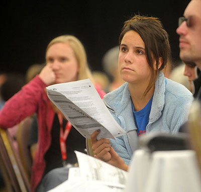 Volunteers listen intently as Rob Fredericks, deputy executive director and chief administrative officer at the Housing Authority of the City of Santa Barbara, explains how to issue surveys to the homeless.