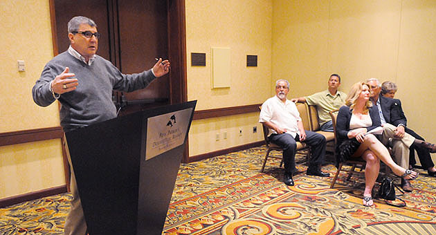 The Milpas Community Association's Rick Feldman speaks Friday about the group's fact-finding trip to Santa Monica while, from left, the MCA's Sebastian Aldana, Alan Bleeker and Sharon Byrne and Santa Barbara City Council members Frank Hotchkiss and Michael Self wait their turn.