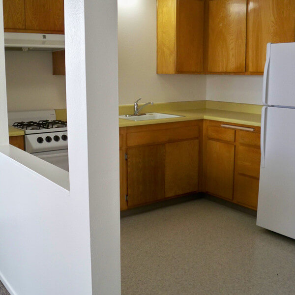 Inside a unit, showing the kitchen from the entryway