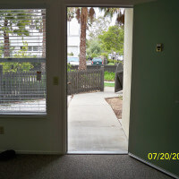 Inside a unit, showing the open door leading outside
