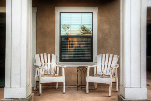 Outside view of two chairs under a window