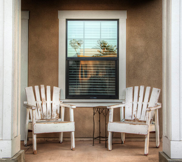 Outside view of two chairs under a window