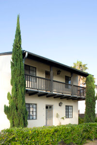 Outside view of two units and the foliage in front of them