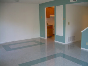 Inside a unit, showing the living room and doorway to the kitchen