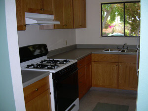 Inside a unit, showing the stove and kitchen sink