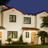 Outside view of a Voluntario front yard and unit at night