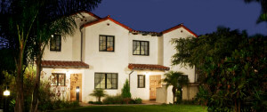 Outside view of a Voluntario front yard and unit at night