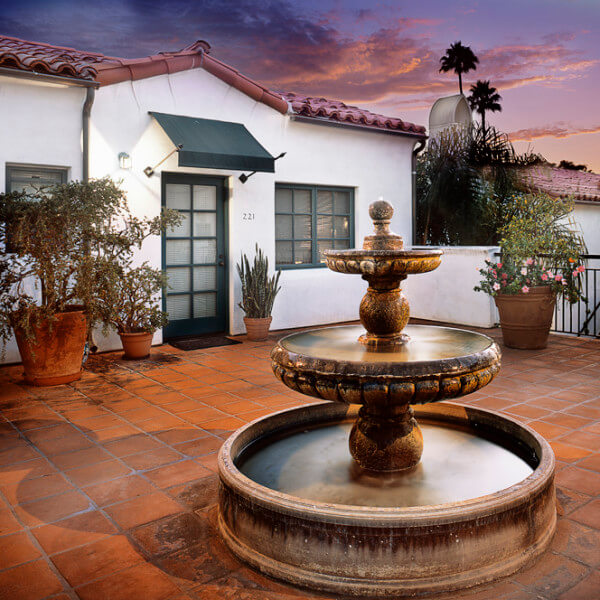 Outside view of the water fountain in front of a unit during dusk