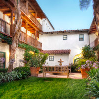 Outside view of the courtyard and units at dusk