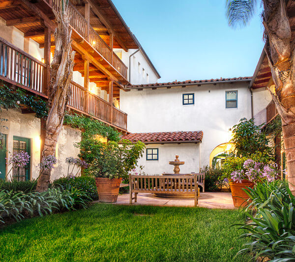 Outside view of the courtyard and units at dusk