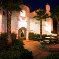 Outside view of the water fountain on the property at night