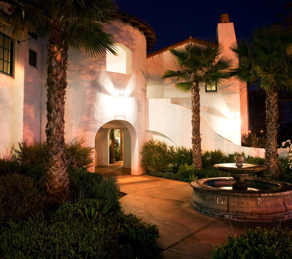Outside view of the water fountain on the property at night