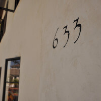 Close-up of the number 633 on the building
