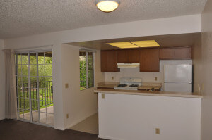 Inside a unit, showing the kitchen and patio door