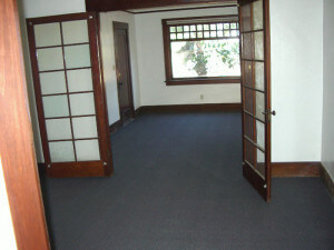 Inside a unit, view of open doors leading to a room