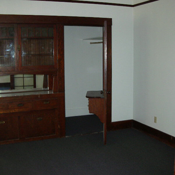 Inside a unit, view of a cabinet and closet door