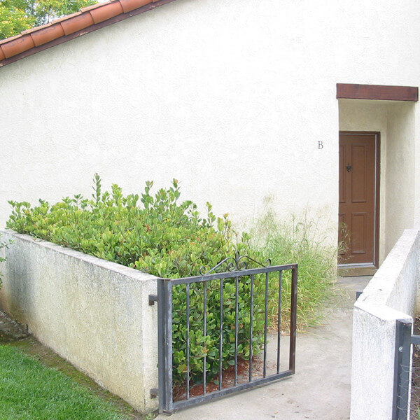 Outside view of a unit and the path leading to the door