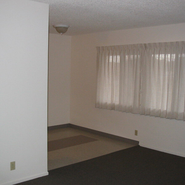 Inside a unit, view of the living room and partial hallway