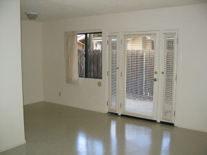 Insidie a unit, view of the living room with a door leading outside