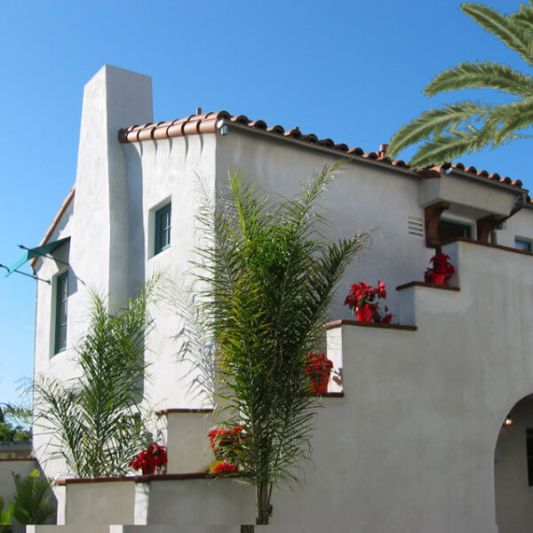 Outside shot of the building and a few palm trees