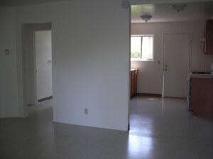 Inside a unit, view of the wall dividing the kitchen and living room