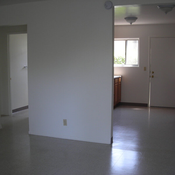 Inside a unit, view of the wall dividing the kitchen and living room