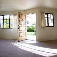 Inside of a Voluntario, showing the living room and open front door