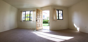 Inside of a Voluntario, showing the living room and open front door