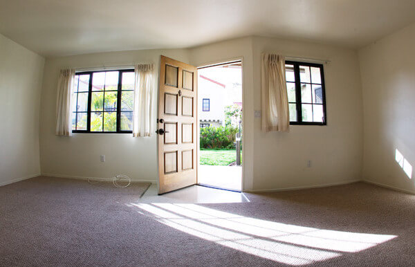 Inside of a Voluntario, showing the living room and open front door