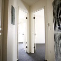 Inside of a Voluntario, showing a hallway with two doors