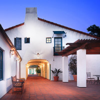 Outside view of the hallway in front of the units, at dusk