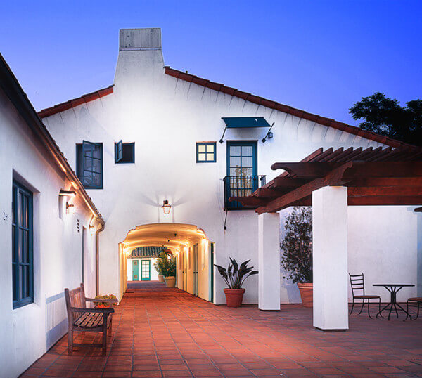 Outside view of the hallway in front of the units, at dusk