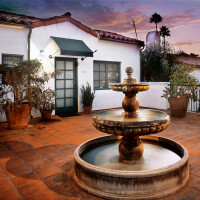 Outside view of the water fountain in front of a unit, at dusk