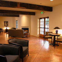 Inside view of the common room with couches, tables, and chairs