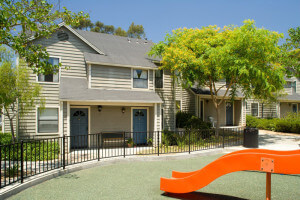 Outside view of the slide of a playground in front of the units