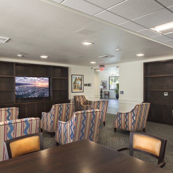 Community room with chairs facing TV