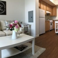 View of living room and kitchen at Grace Village Apartments