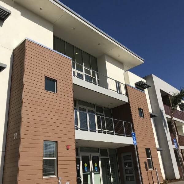Ground up view of front of Grace Village Apartments
