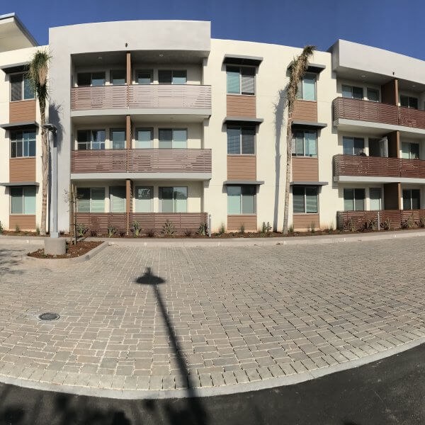 Panorama of completed structure of Grace Village Apartments