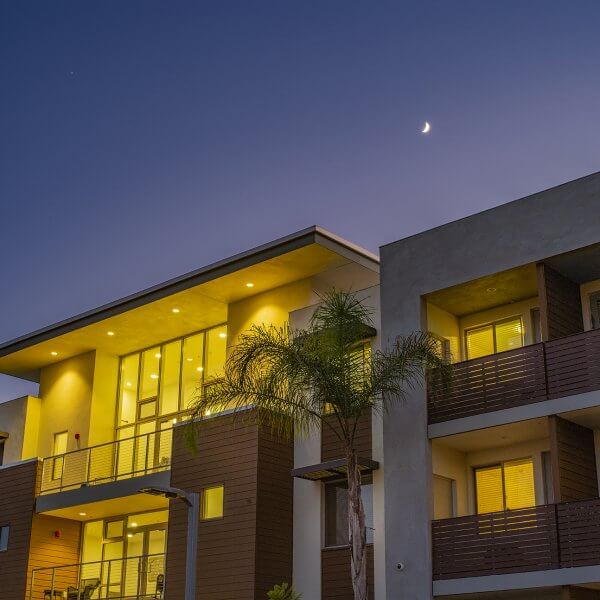 Looking up at completed architecture against night sky